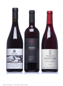 Three bottles of Etna Rosso wine.
